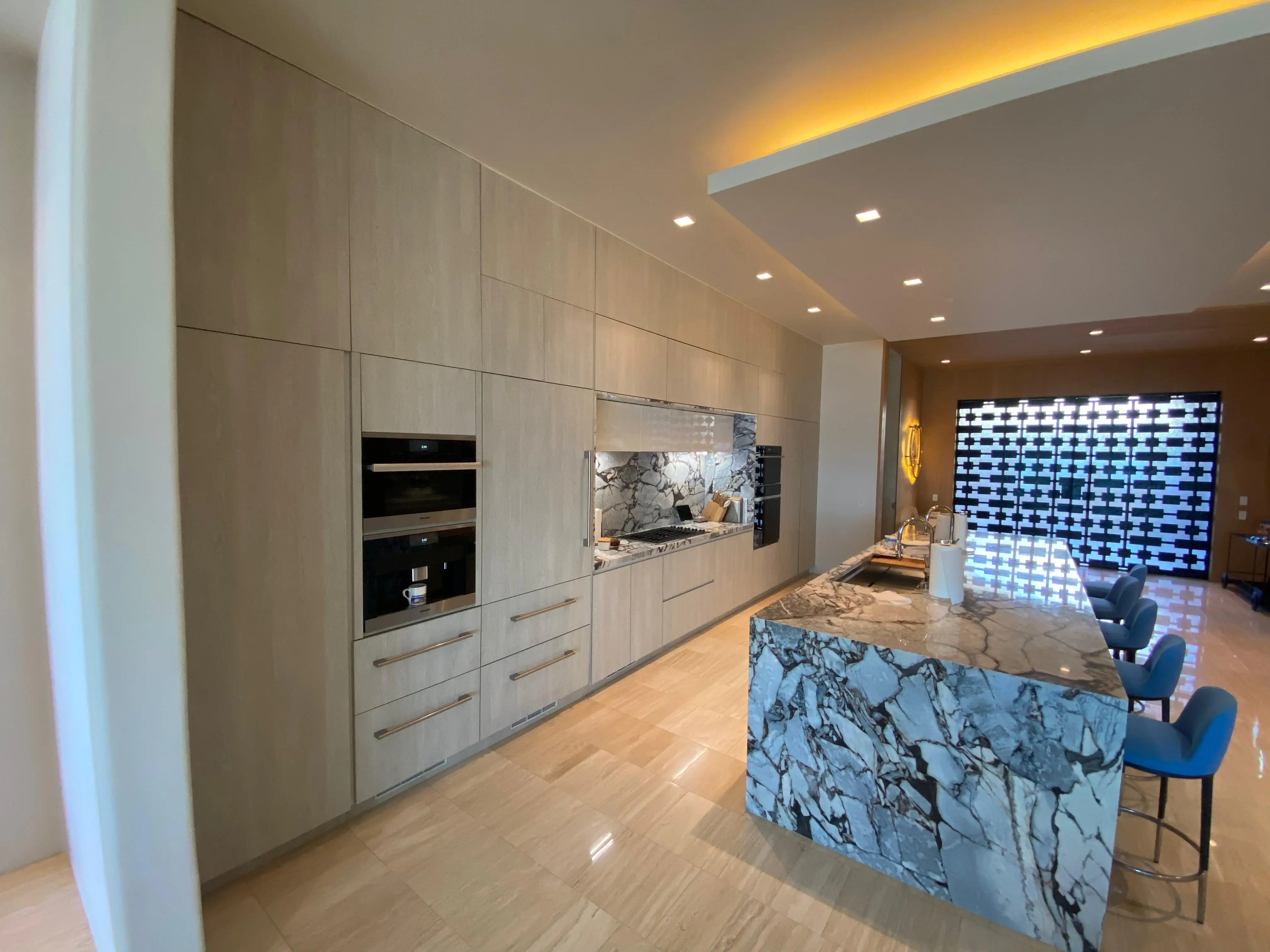 High-end laundry room cabinets with premium wood finish by Cabo carpentry experts