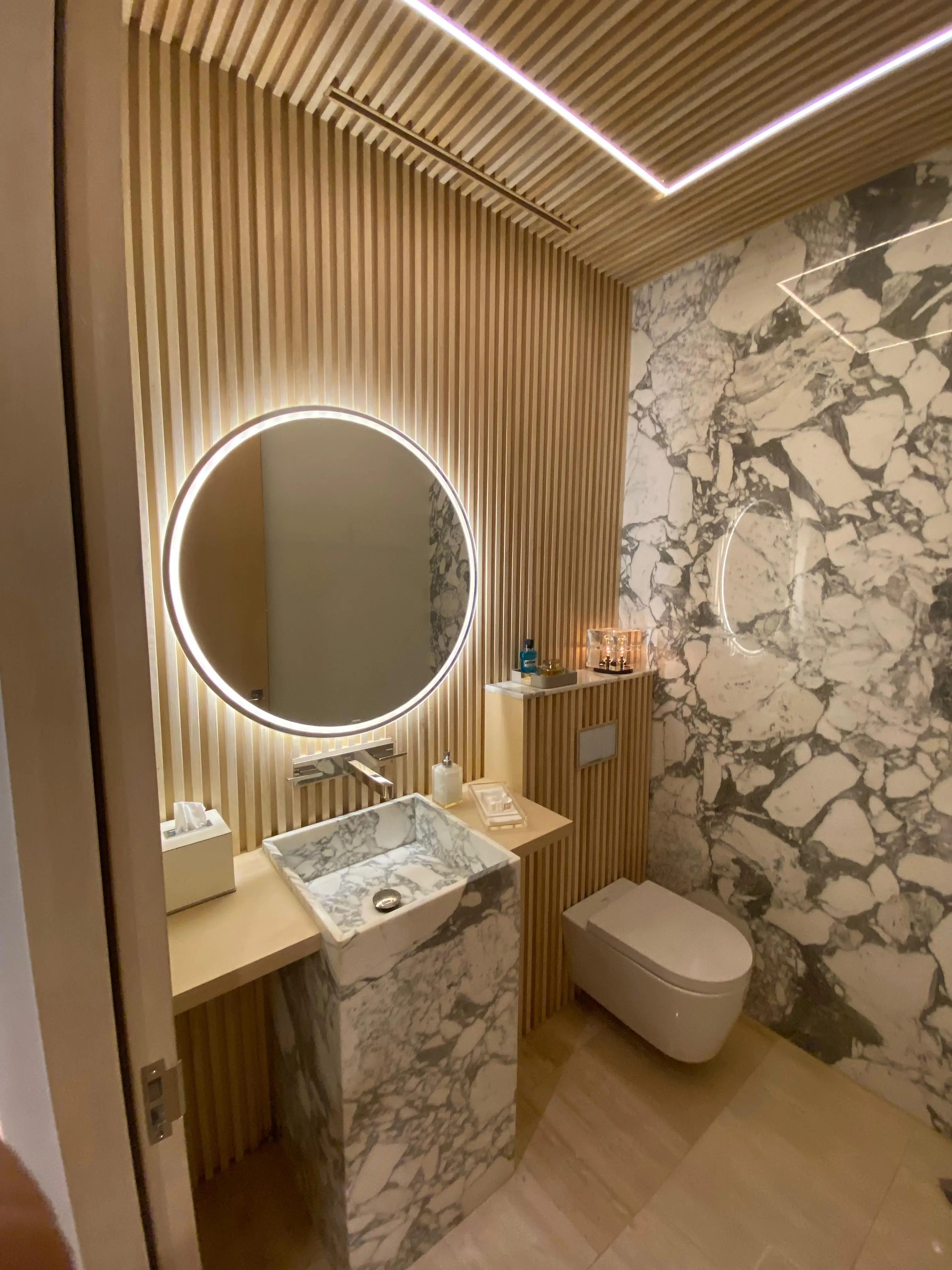 Luxury outdoor kitchen with custom wood cabinets in beachfront Cabo San Lucas home