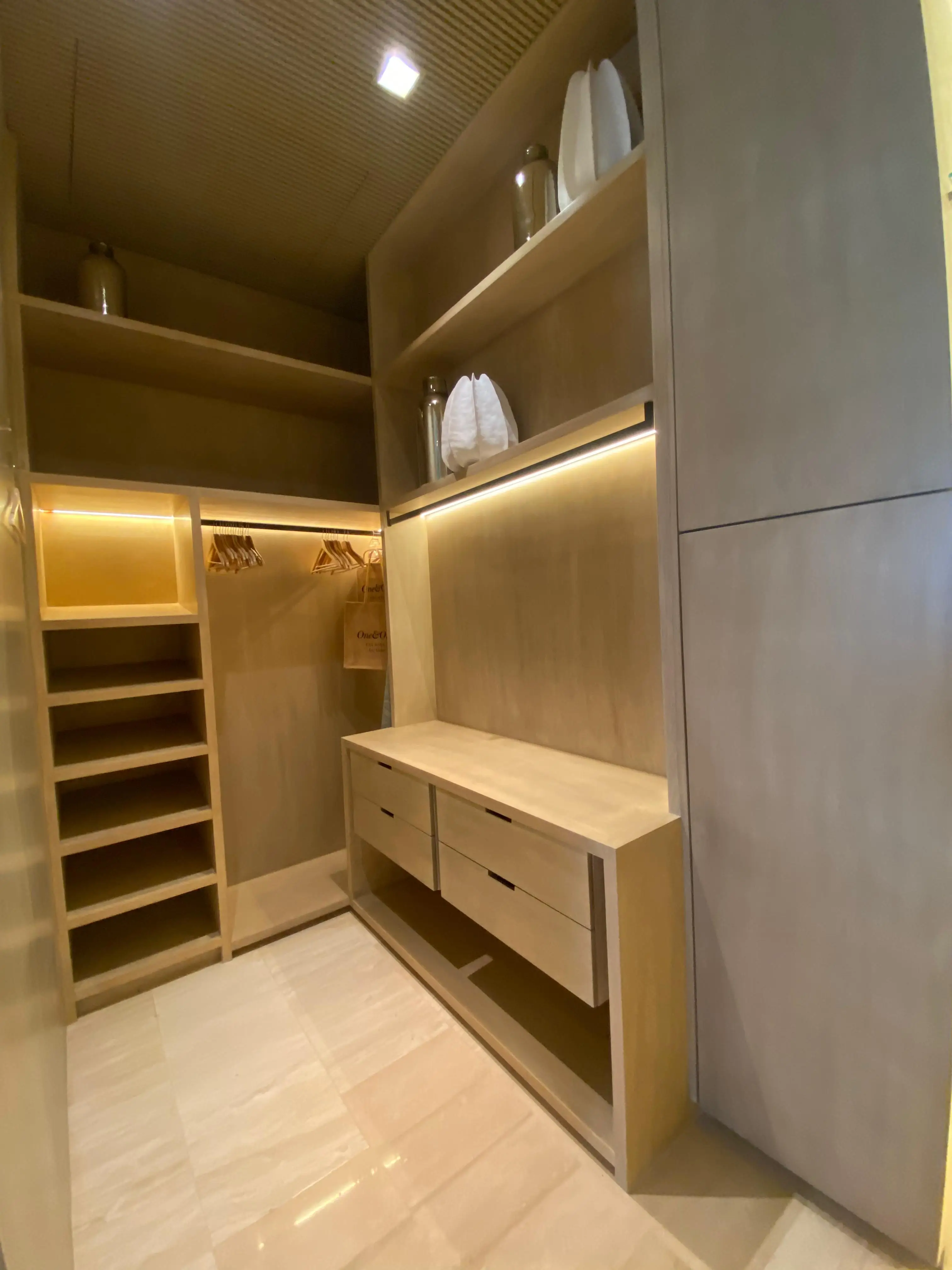 Custom wood feature wall with display shelving for modern Cabo villa